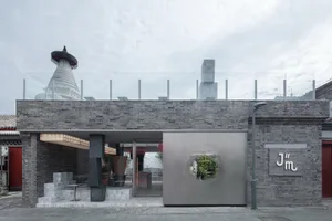 Commercial storefront with brick and metal exterior, featuring a modern design.