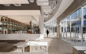 Modern cafe with marble, glass, metal, and concrete interior design.