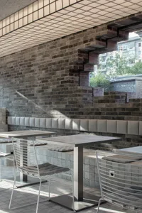 Modern cafe interior with steel and brick materials