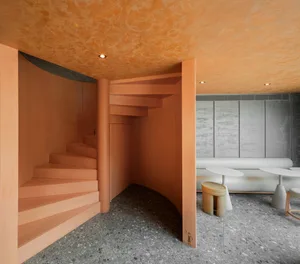 A minimalist interior design featuring wooden elements.