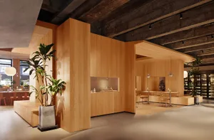 Modern coffee shop with wooden interior and seating areas.