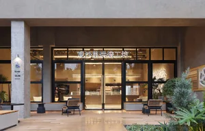 Modern cafe exterior with concrete and glass