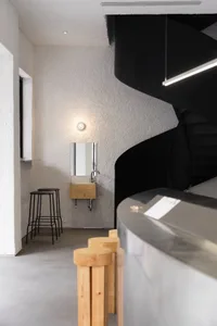 Industrial-style coffee shop with concrete counter and minimalist design