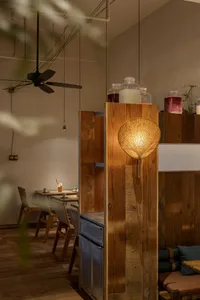 Industrial style restaurant interior with metal and wooden furniture and decor.