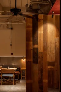 The interior of a restaurant with wooden panels and a rustic ambiance