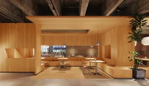 A modern restaurant interior with wooden walls and a polished concrete floor.