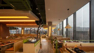 Restaurant interior with warm lighting and wooden elements