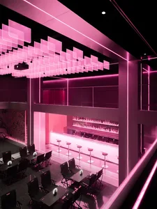 Modern industrial bar with transparent lighting panels and café interior design.