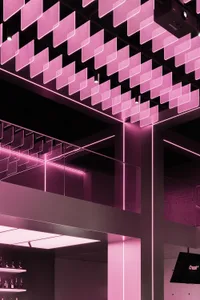 Modern minimalist restaurant interior with glass panel ceiling and lighting design.