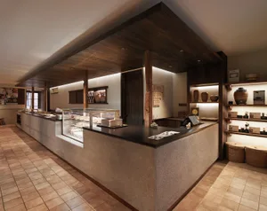 Modern coffee shop interior showcasing sleek, wood finishes