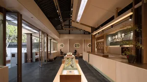 Modern coffee shop featuring wooden beams and seating areas