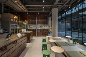 Industrial-style cafe interior with concrete and wooden elements