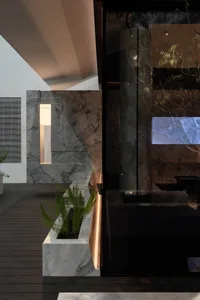 A minimalist coffee shop interior with marble finishes and a modern design.