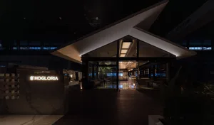 A modern retail storefront featuring glass materials and contemporary design elements.