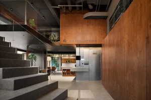Industrial-style restaurant interior featuring concrete, wood, and metal materials