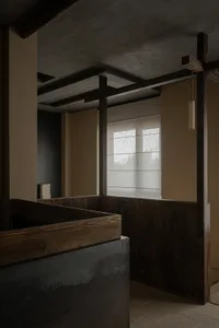 Modern bathroom with concrete walls and wooden accents.