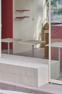 Modern interior design featuring concrete dining tables and minimalist design elements.