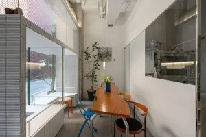 Industrial-style cafe interior with metal and wood furniture.