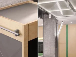 The image shows an industrial-style interior with concrete, glass, and steel materials.