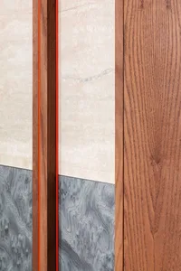 A modern interior design featuring wood, marble, and concrete materials