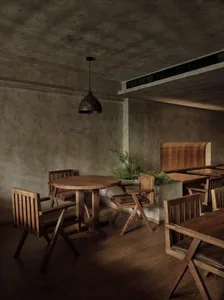 A modern restaurant interior featuring wooden furniture and a cozy ambiance.