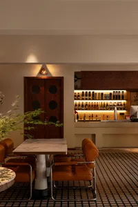 A modern cafe bar featuring wooden and marble materials