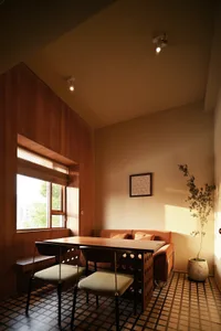 A modern living room featuring wooden furniture and flooring.