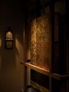 A wooden decorative panel with intricate geometric and floral designs.