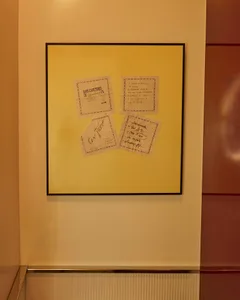 Documents pinned on a yellow background.