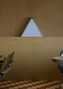 Modern interior design featuring wooden walls and a geometric triangle wall feature.