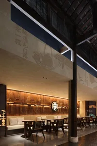 Urban industrial-style restaurant interior with wooden elements and modern design