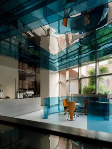 Coffee shop interior with modern design, glass ceiling, and seating area