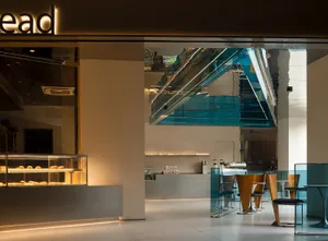 Modern coffee shop with glass counter and minimalist design