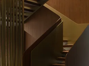 Staircase with modern design featuring wooden steps and railings.