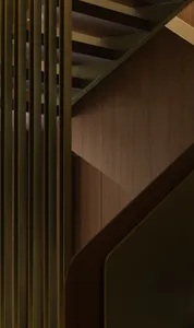 A modern staircase featuring wooden paneling, photographed in a detailed and close-up view.