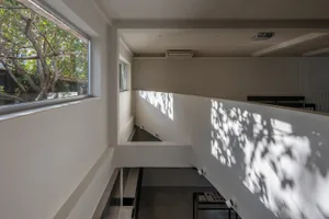 A minimalist interior space with modern lighting