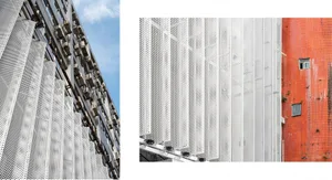 Modern exterior wall with perforated metal panels against a blue sky.