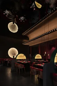 Industrial-style restaurant interior with metal, glass, and wood materials.