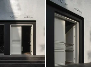 Modern bar entrance with black and white color scheme.
