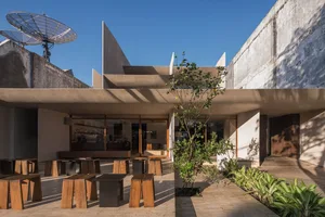 Modern, exterior architectural design with concrete and a satellite dish.