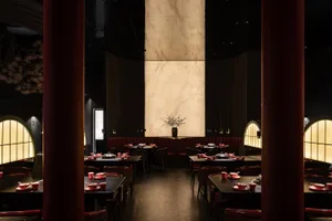 A beautifully designed modern restaurant interior featuring marble and leather materials.