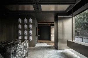 Modern retail storefront entry with metal and glass materials