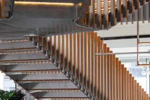 Modern staircase featuring steel and wooden elements