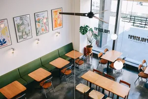 Interior design of a modern restaurant with contemporary seating, tables, and decorative elements.