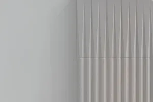 A minimalist interior space featuring concrete curtains and a plain white wall.