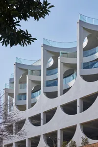 Modern building facade constructed from concrete materials.