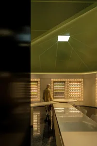 A modern interior of a coffee shop with matte metallic finishes.