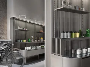 A modern industrial retail display showcasing metal shelves and a metallic bicycle in a contemporary store setting.