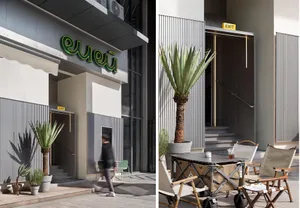 Modern storefront with concrete, glass, and metal elements.