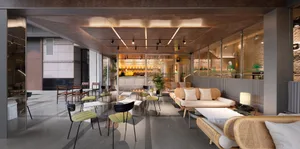 Modern industrial-style coffee shop with wooden furniture and concrete flooring.